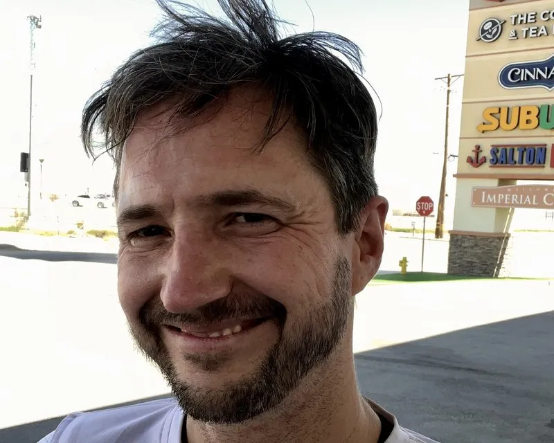 Nils outside a commercial strip — the buyer’s perspective most riders forget to take seriously enough.