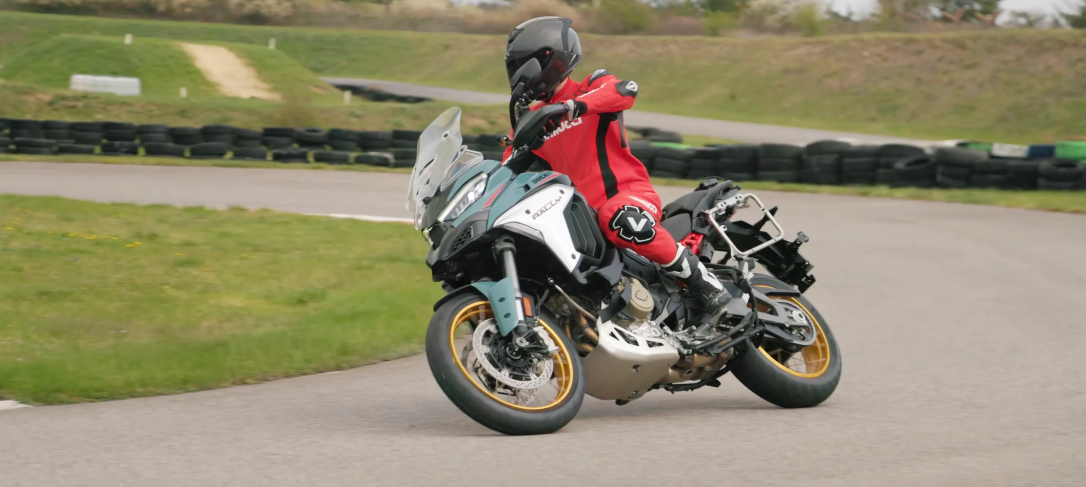 Nils Mueller leans the 2026 Ducati Multistrada V4 Rally hard into a tight Austrian supermoto corner on Bridgestone T33s.