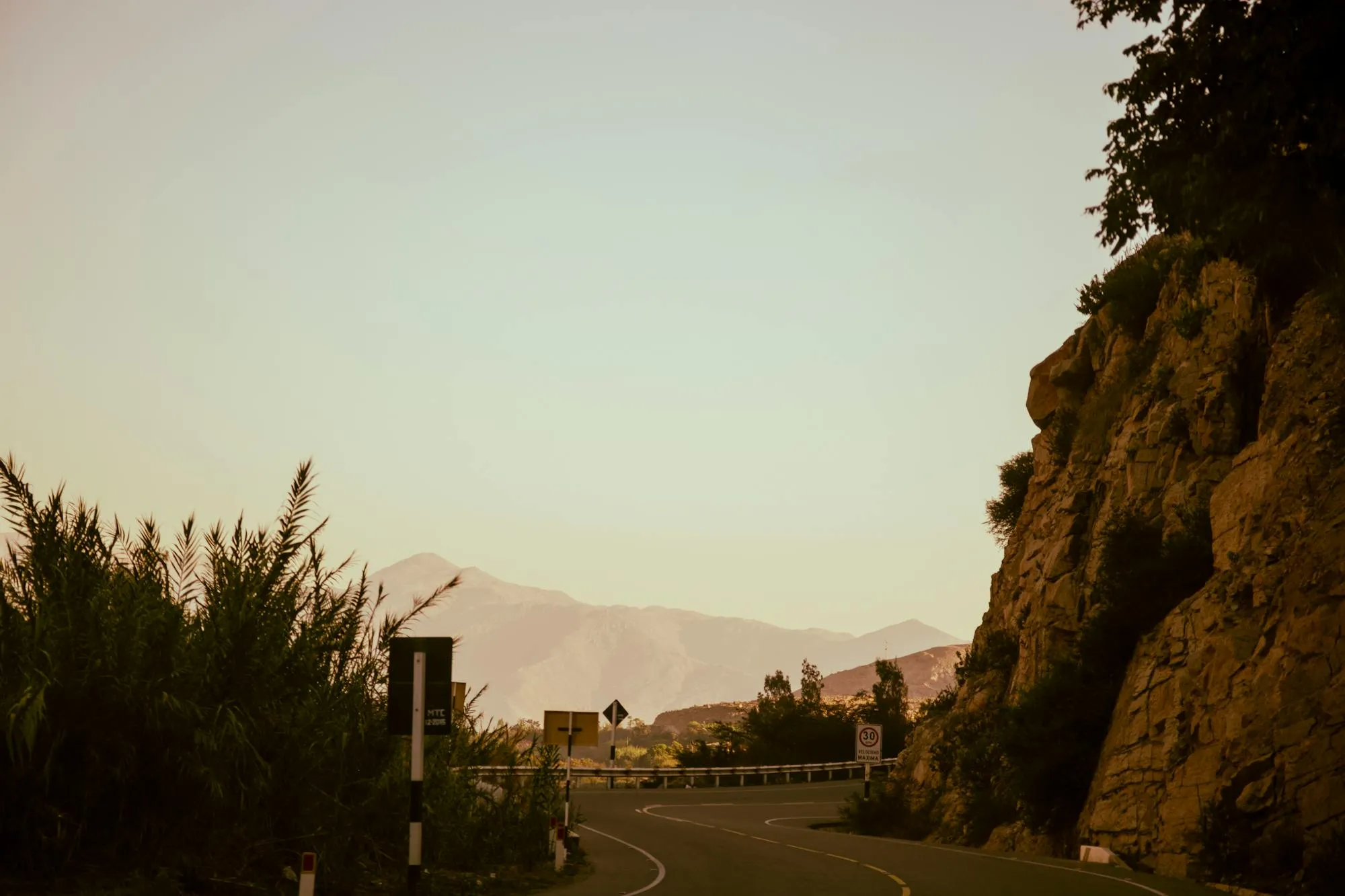 Mulholland Drive at sunset — a winding canyon road through the Santa Monica mountains, the kind of asphalt where mid-weight naked bikes shine.