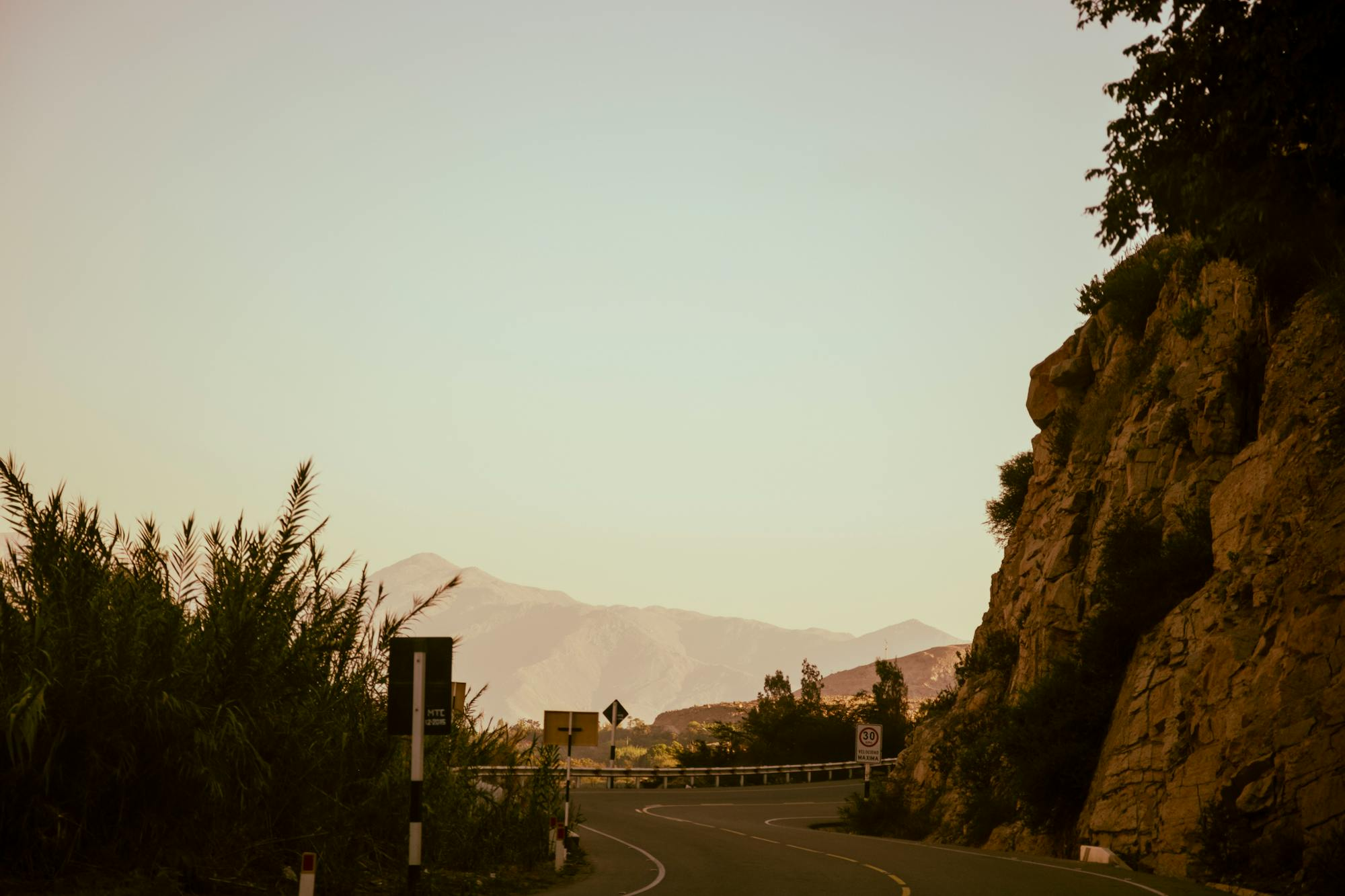 Mulholland Drive at sunset — a winding canyon road through the Santa Monica mountains, the kind of asphalt where mid-weight naked bikes shine.