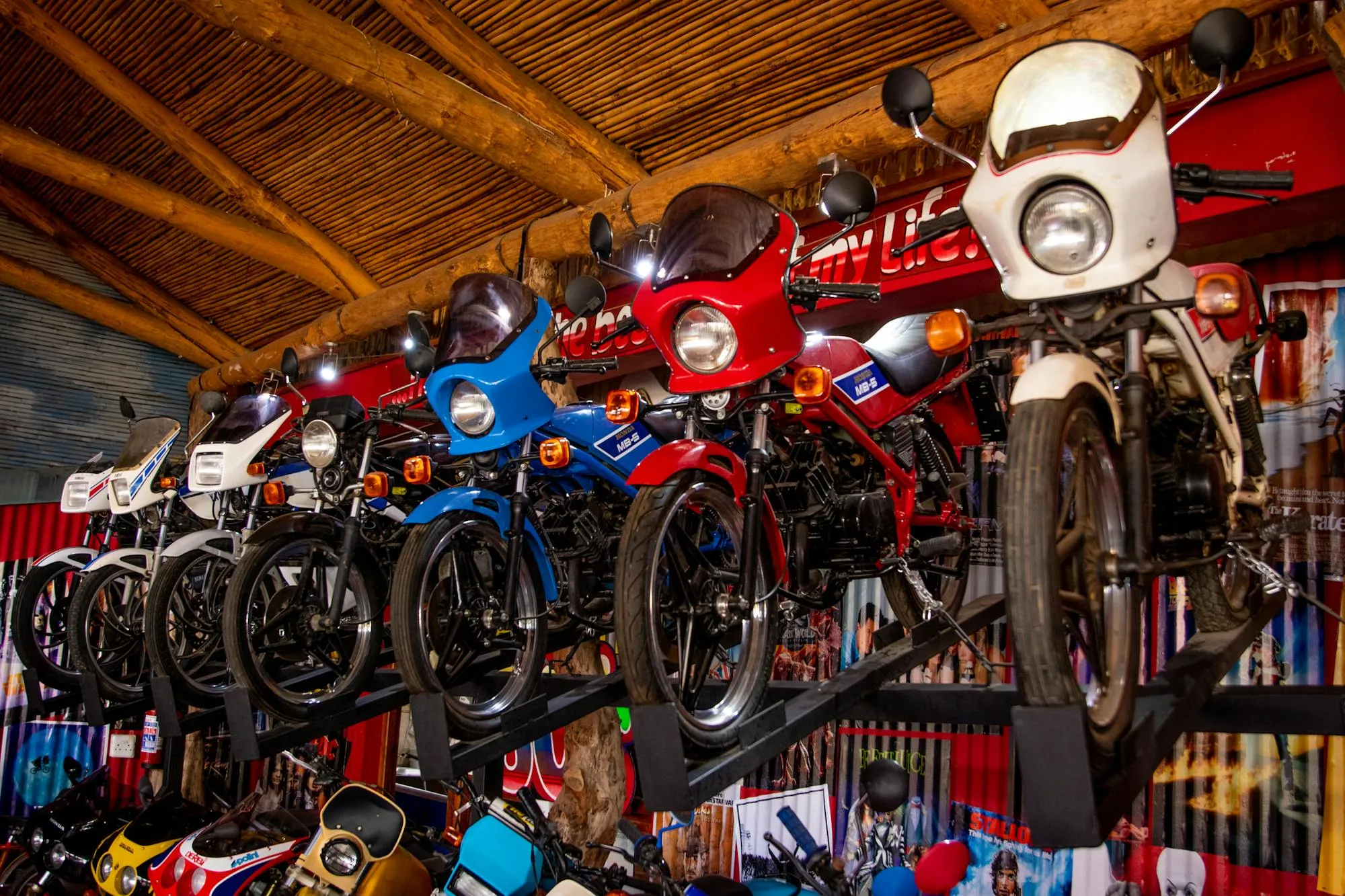 A row of classic motorcycles displayed in a showroom — the place where most buyers negotiate for the wrong things at the wrong time.
