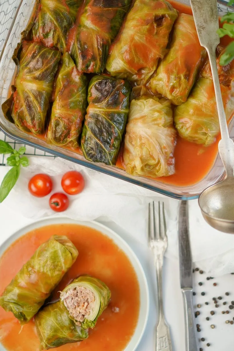 Sarmale, Romanian cabbage rolls stuffed with minced meat and rice in tomato sauce.