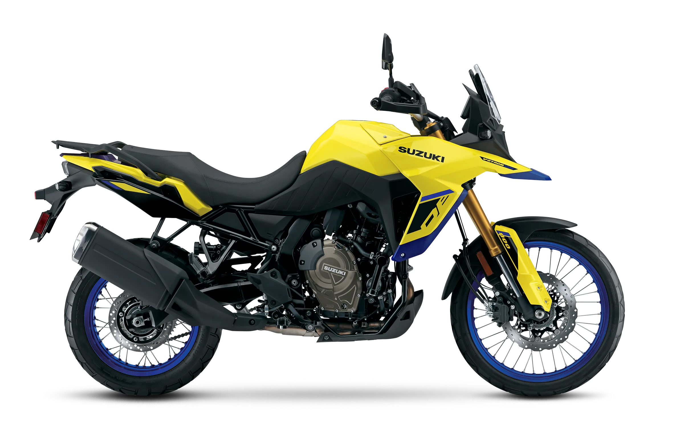 Suzuki V-Strom 800DE photographed side-on against a clean white studio backdrop, yellow-blue color scheme highlighting the adventure-sport fairing, spoked wheels, upright riding position, and dual-disc front brake setup.